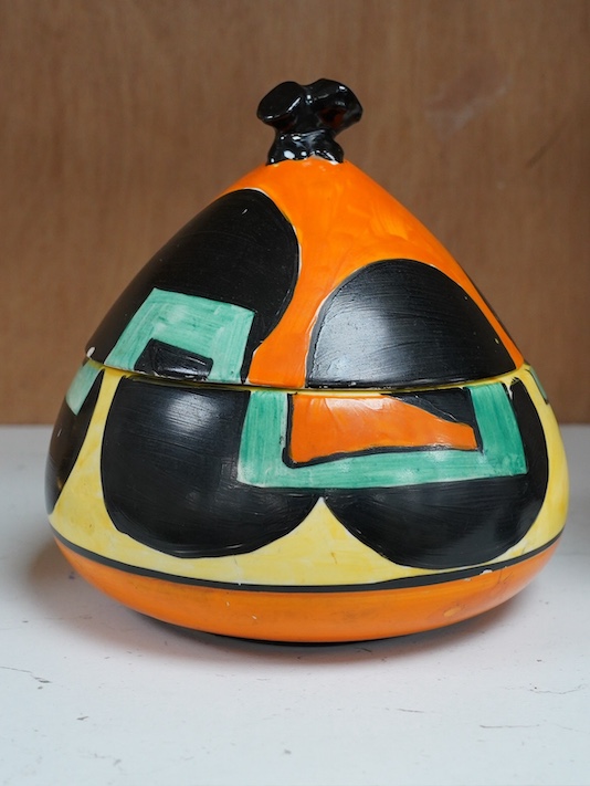 A Clarice Cliff Bizarre bon-bon jar and cover, 14cm. Condition - poor to fair, discoloured crazing to interior